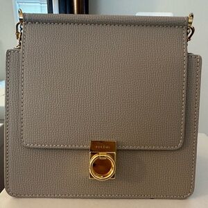 Brand new. Never used Numero Sept mini textured taupe